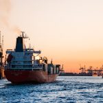 A photo of a cargo ship in the sea.