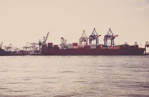 A ship on the sea carrying cargo.