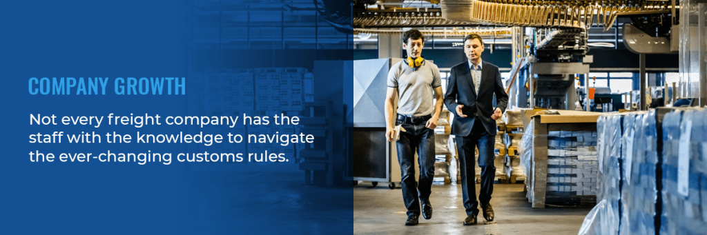 two shipping agents walking in a warehouse